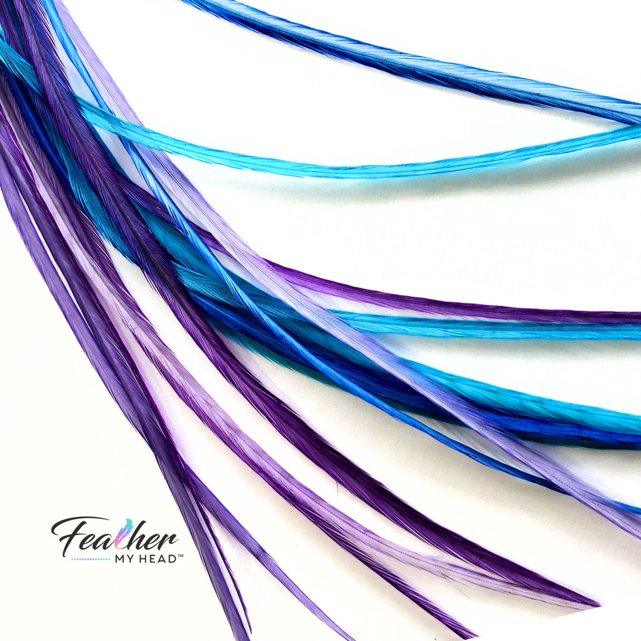 Hair Feather Extensions - Dancing Waters - A mesmerizing fusion of purple, blue, and turquoise hues that evoke the graceful movements and tranquility of water. These long feather extensions available over 16 inches are the perfect way to embellish your hair with the serene beauty of a sun-kissed lagoon.