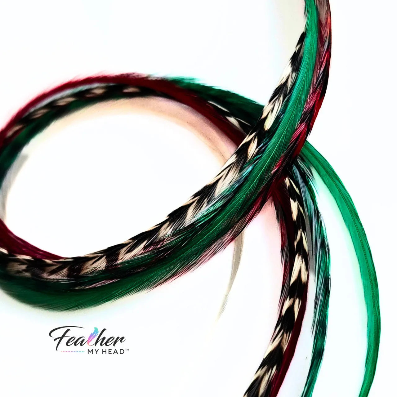 Dive into the holiday fun with our Elfin Around Christmas Collection of feather extensions! This 6-piece pack of hair feather extensions brings a playful touch to your look. With vibrant red, green, classic white, and natural black and white grizzly hair feathers, Elfin Around adds a festive twist to your hair. Get ready to embrace the holiday spirit and Elf Around in style!