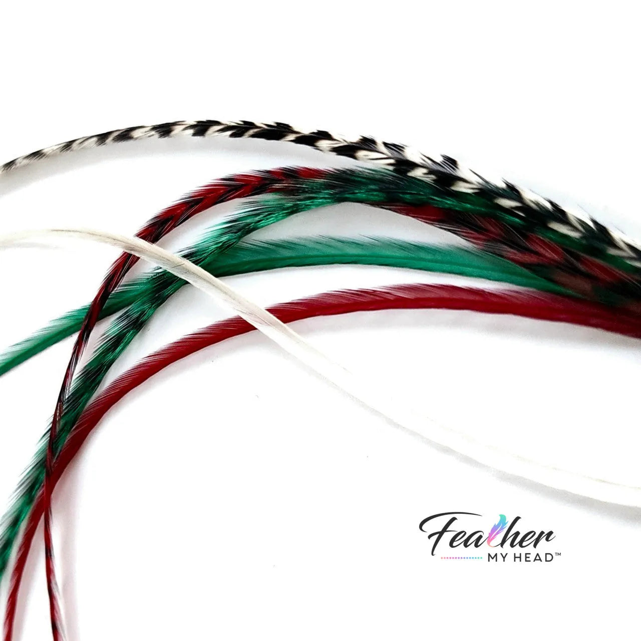 Dive into the holiday fun with our Elfin Around Christmas Collection of feather extensions! This 6-piece pack of hair feather extensions brings a playful touch to your look. With vibrant red, green, classic white, and natural black and white grizzly hair feathers, Elfin Around adds a festive twist to your hair. Get ready to embrace the holiday spirit and Elf Around in style!