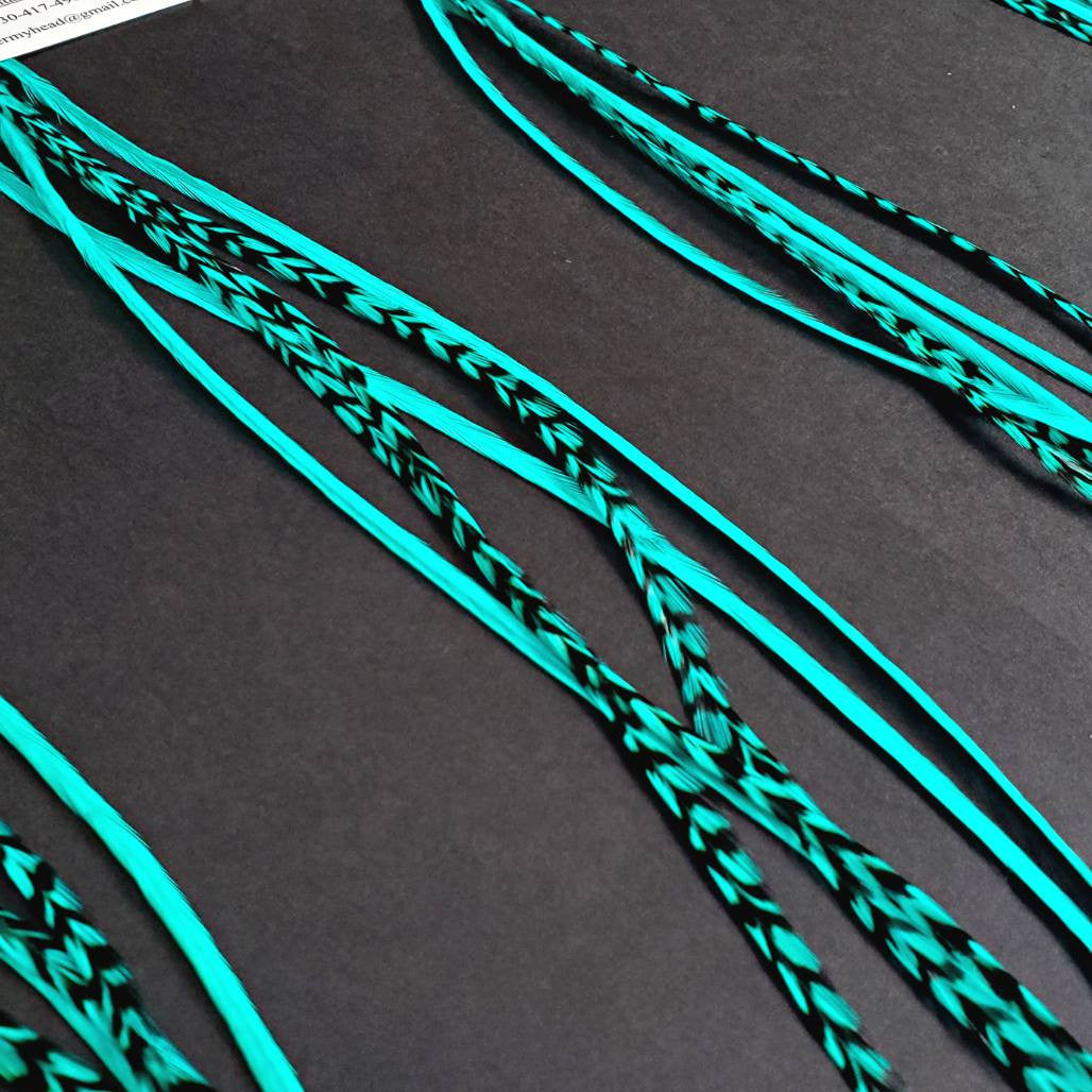 Hair Feather Extensions dyed a bright Bubble Aqua Blue Color. Create your own custom mix or custom order with our single hair feathers.