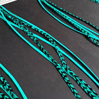 Hair Feather Extensions dyed a bright Bubble Aqua Blue Color. Create your own custom mix or custom order with our single hair feathers.