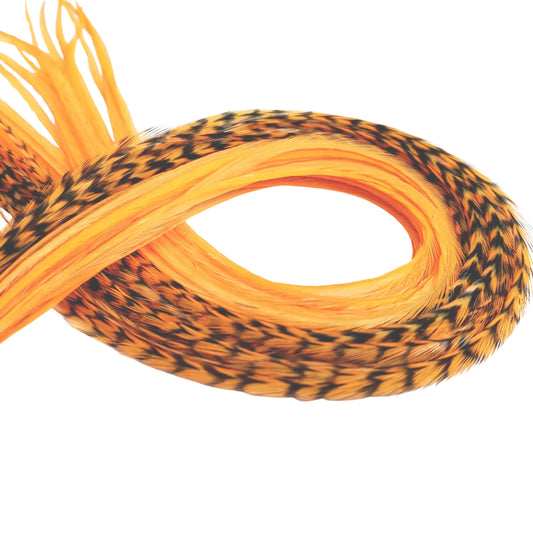 Neon orange hair feather extension single, UV reactive glow under black light