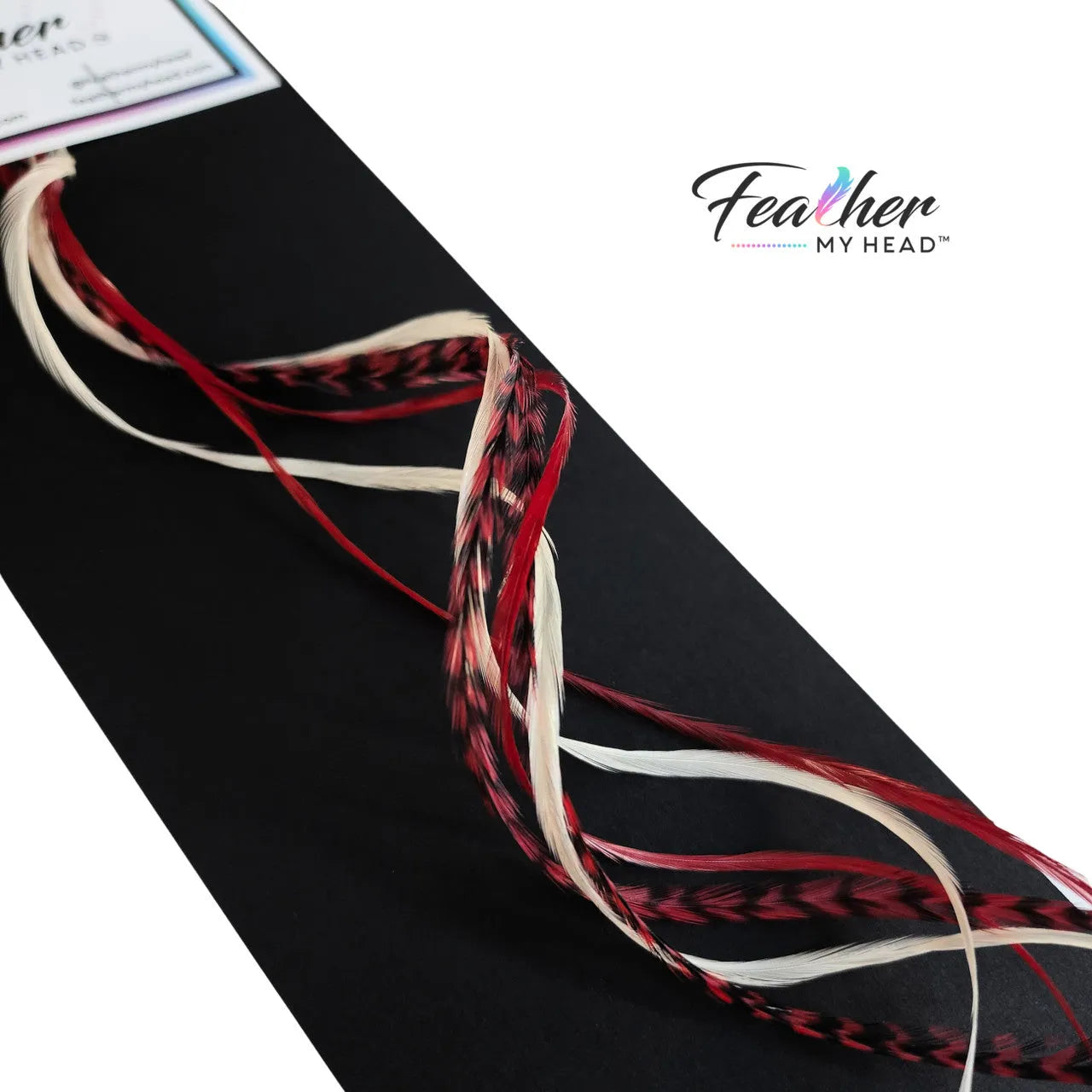 Unleash the magic of the season with our Naughty or Nice hair feather Collection! Dive into a world where crimson red and snow-white feathers come together. Dare to be a little naughty, embrace the nice – let the feathers tell your festive story.