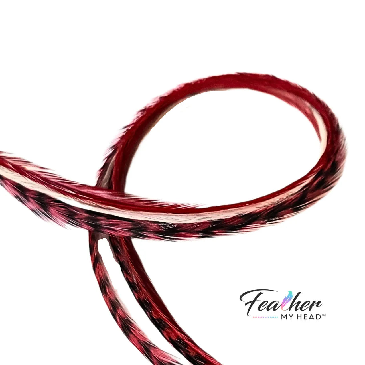 Unleash the magic of the season with our Naughty or Nice hair feather Collection! Dive into a world where crimson red and snow-white feathers come together. Dare to be a little naughty, embrace the nice – let the feathers tell your festive story.