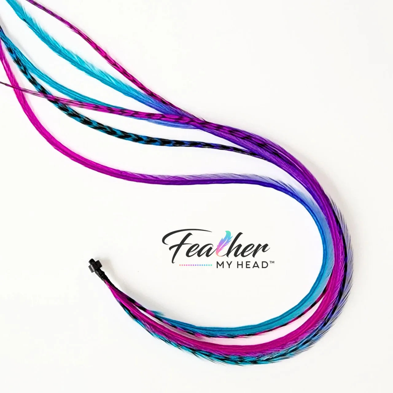 Let your hair catch the spirit of summers carefree days and warm summer nights with our hand-dyed hair feathers.

Each feather extension is unique blending shades of pink, purple, blue, and turquoise for mesmerizing rainbow tie-dye effect
