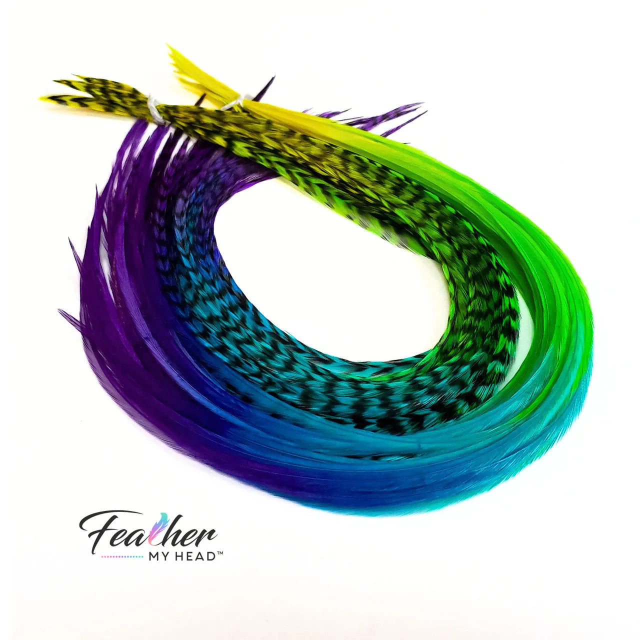 Our Snow Cone hair feather extensions are inspired by the swirled, icy treat that turns every tongue a different shade. Each hand-dyed feather blends vivid tones of purple, blue, green, and yellow, creating a stunning tie-dye effect.