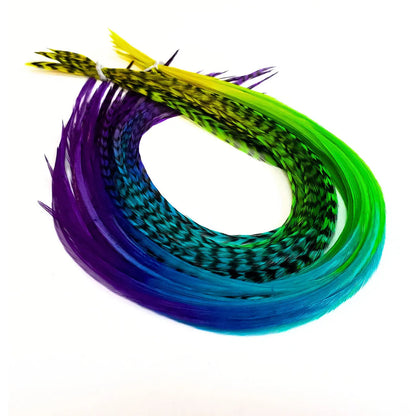 Our Snow Cone hair feather extensions are inspired by the swirled, icy treat that turns every tongue a different shade. Each hand-dyed feather blends vivid tones of purple, blue, green, and yellow, creating a stunning tie-dye effect.