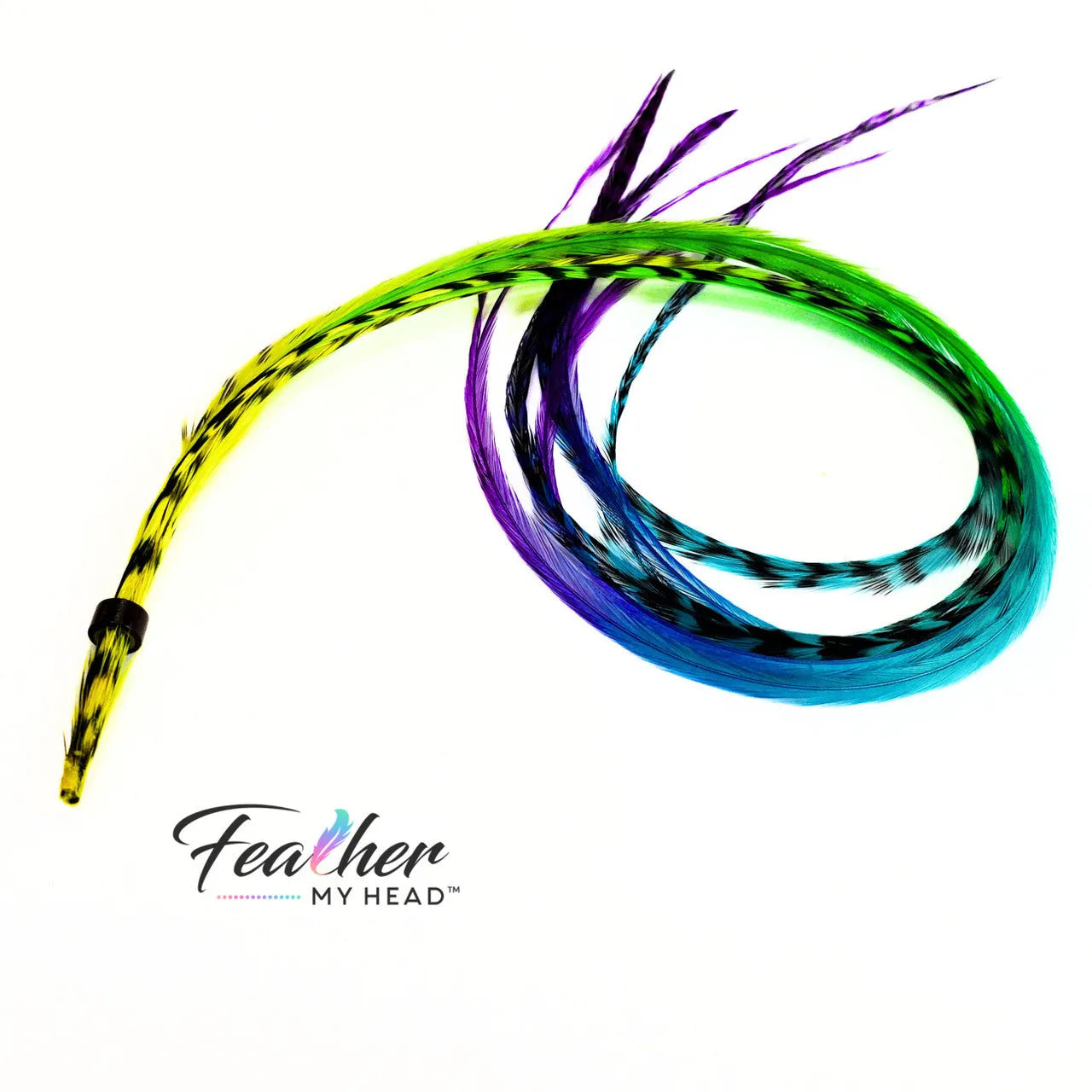 Our Snow Cone hair feather extensions are inspired by the swirled, icy treat that turns every tongue a different shade. Each hand-dyed feather blends vivid tones of purple, blue, green, and yellow, creating a stunning tie-dye effect.
