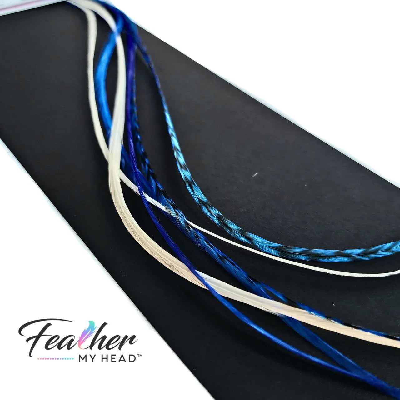 Check out our "Let It Snow Blue and White" hair feathers from the Christmas Collection! They're the perfect way to add a festive touch to your holiday look. Whether you're going for a winter wonderland vibe or just want to add a cool accent to your style, these blue and white feathers are the ideal way to let it snow! 