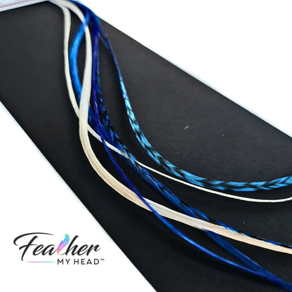 Check out our "Let It Snow Blue and White" hair feathers from the Christmas Collection! They're the perfect way to add a festive touch to your holiday look. Whether you're going for a winter wonderland vibe or just want to add a cool accent to your style, these blue and white feathers are the ideal way to let it snow! 