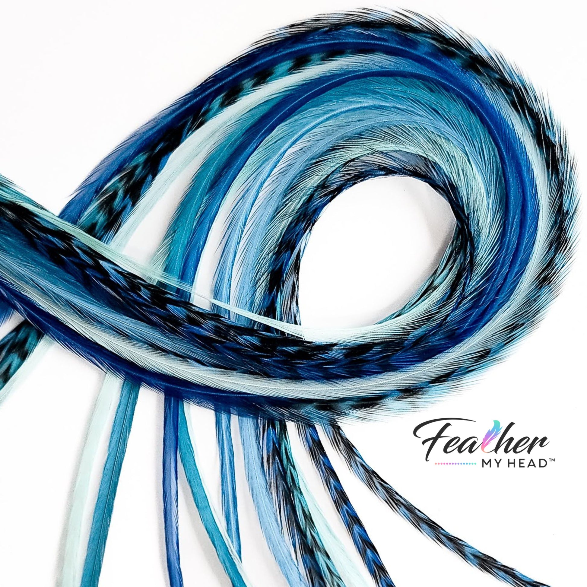 Coiled Sea Glass feather hair extensions showing soft blue and aqua tones with natural movement