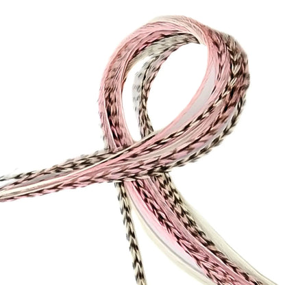 Our Strawberry Champagne Hair Feathers feature soft pink and creamy white hues, inspired by the sweetness of fresh strawberries and the elegance of champagne. These long, flowing feathers add a dreamy, romantic touch with a hint of playful charm.