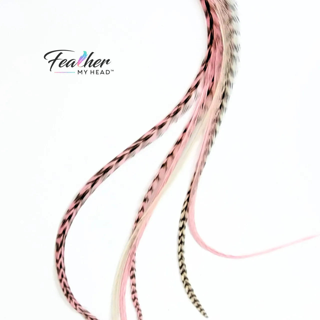 Our Strawberry Champagne Hair Feathers feature soft pink and creamy white hues, inspired by the sweetness of fresh strawberries and the elegance of champagne. These long, flowing feathers add a dreamy, romantic touch with a hint of playful charm.