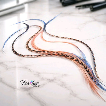 feather hair extensions blue coral ombre in salon setting