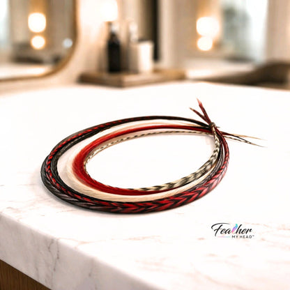 Close up of Sedona rooster feather hair extensions showing red and burgundy feather patterns.