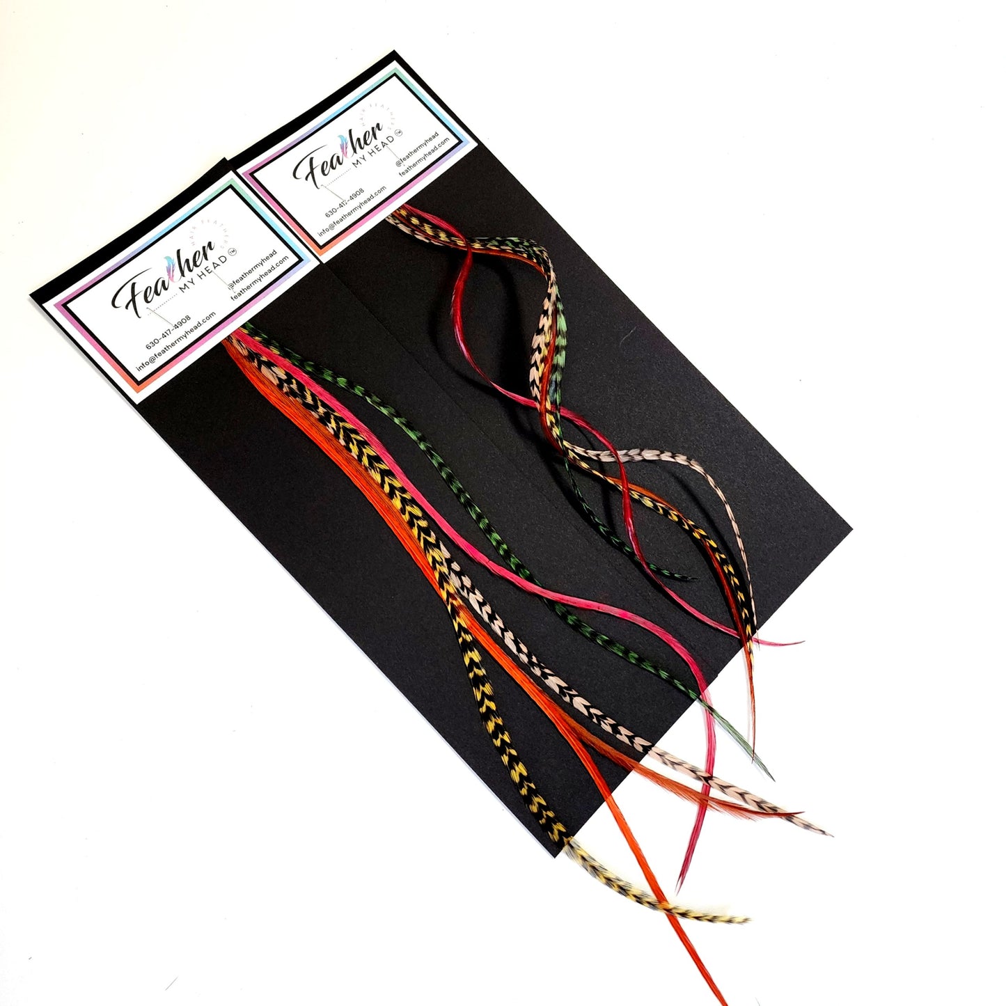 Sherwood Forest hair feather bundle packaging with earthy green, copper, brown, and natural patterned feather hair extensions