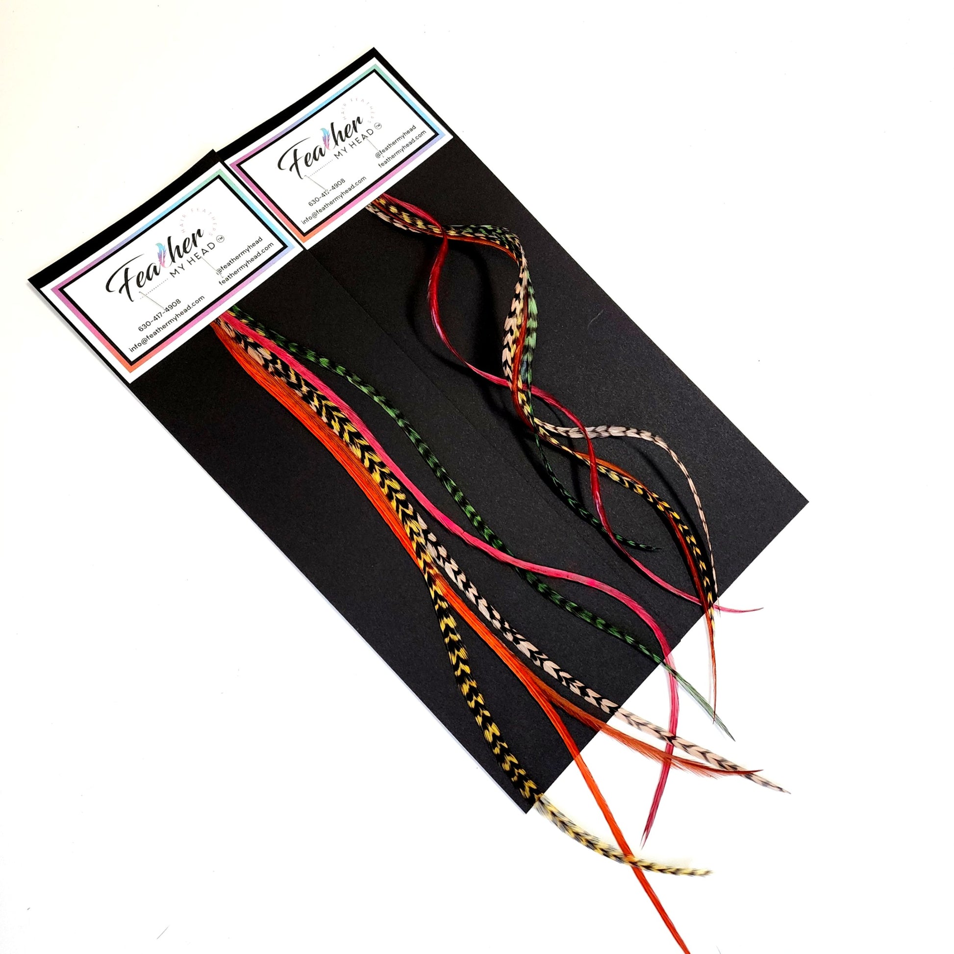 Sherwood Forest hair feather bundle packaging with earthy green, copper, brown, and natural patterned feather hair extensions