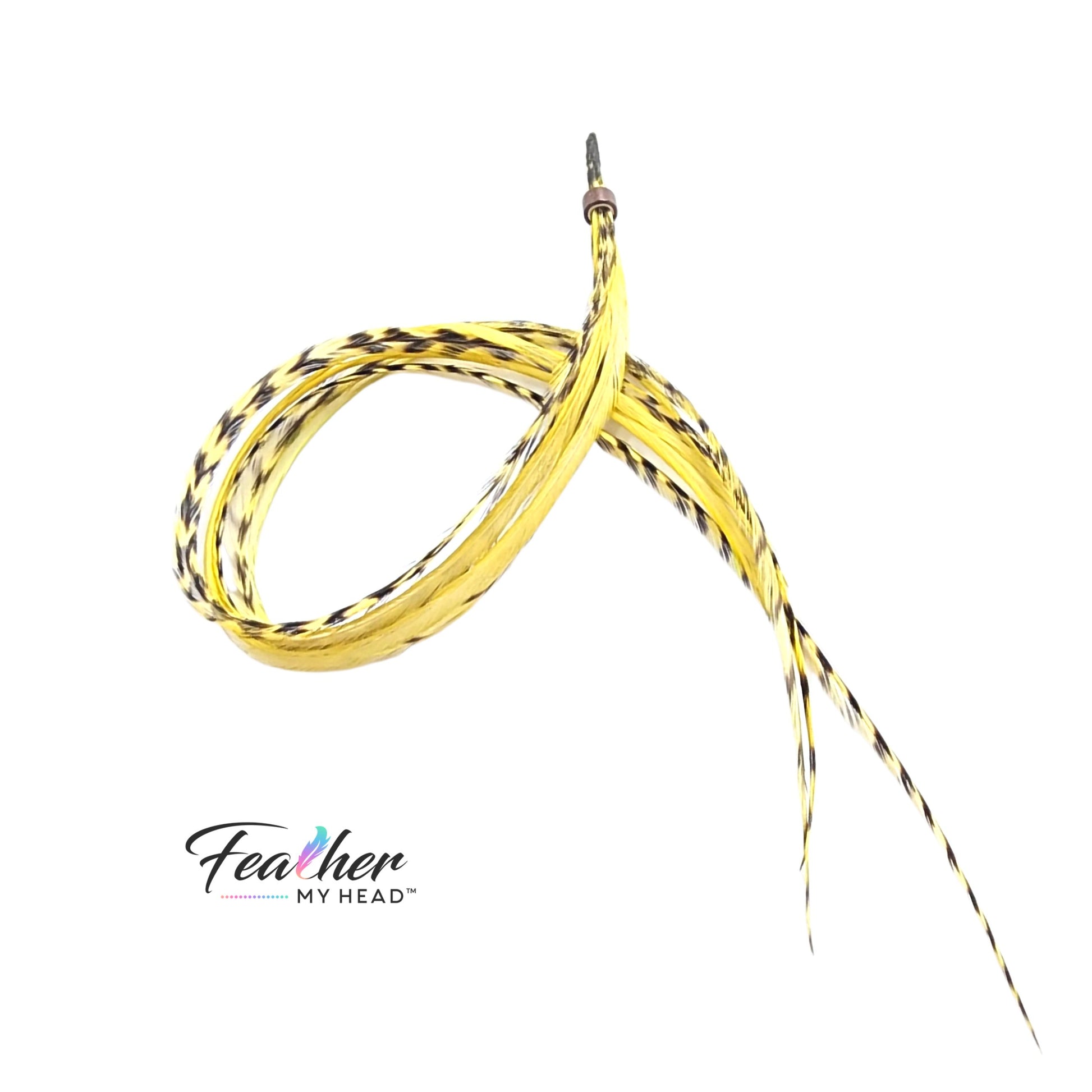 Extra long yellow feather hair extensions blended into blonde hair