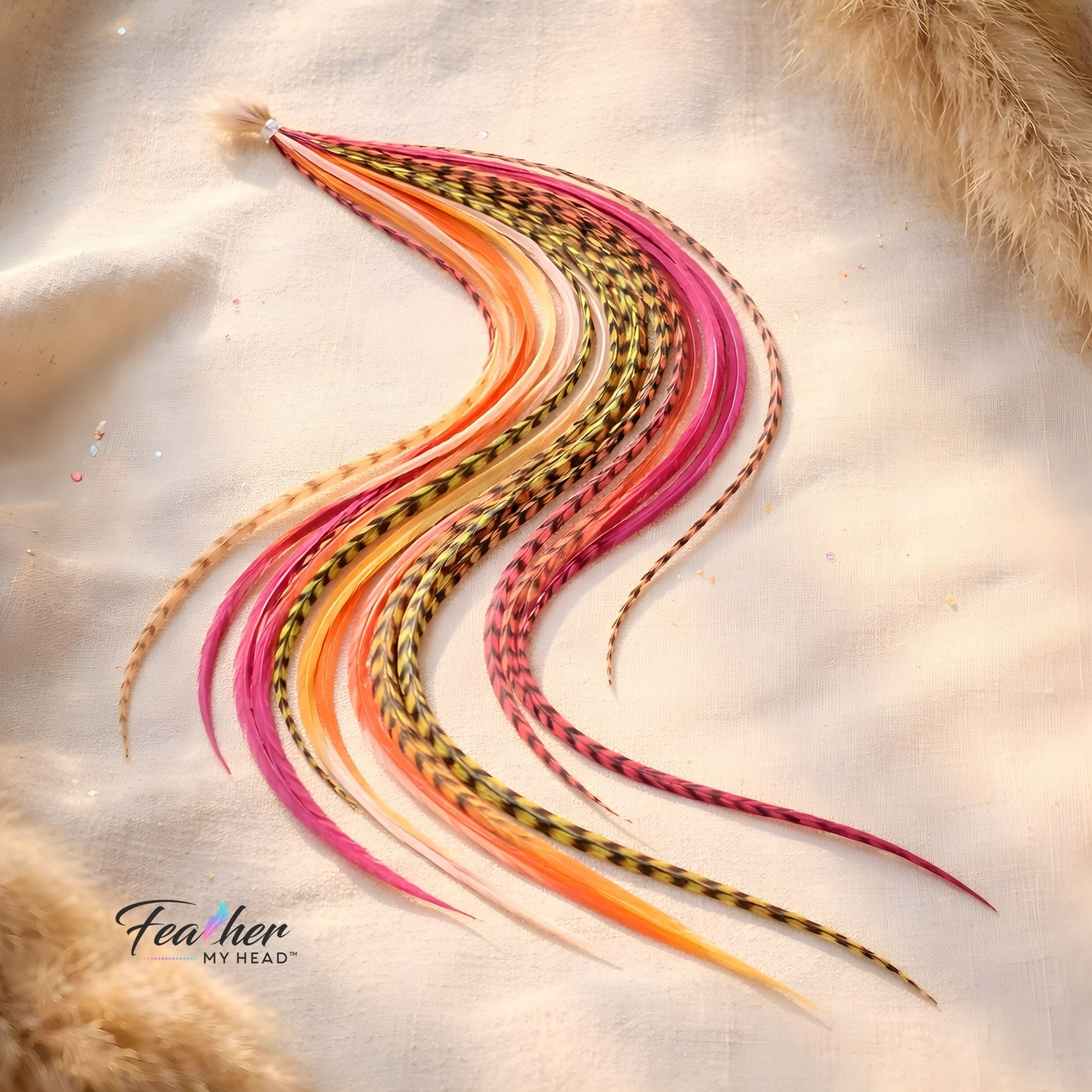 Long rooster feather hair extensions in Tequila Sunrise color blend