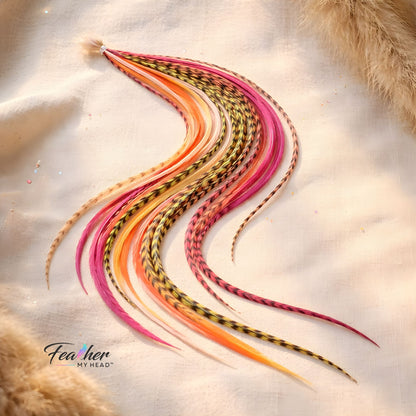 Long rooster feather hair extensions in Tequila Sunrise color blend